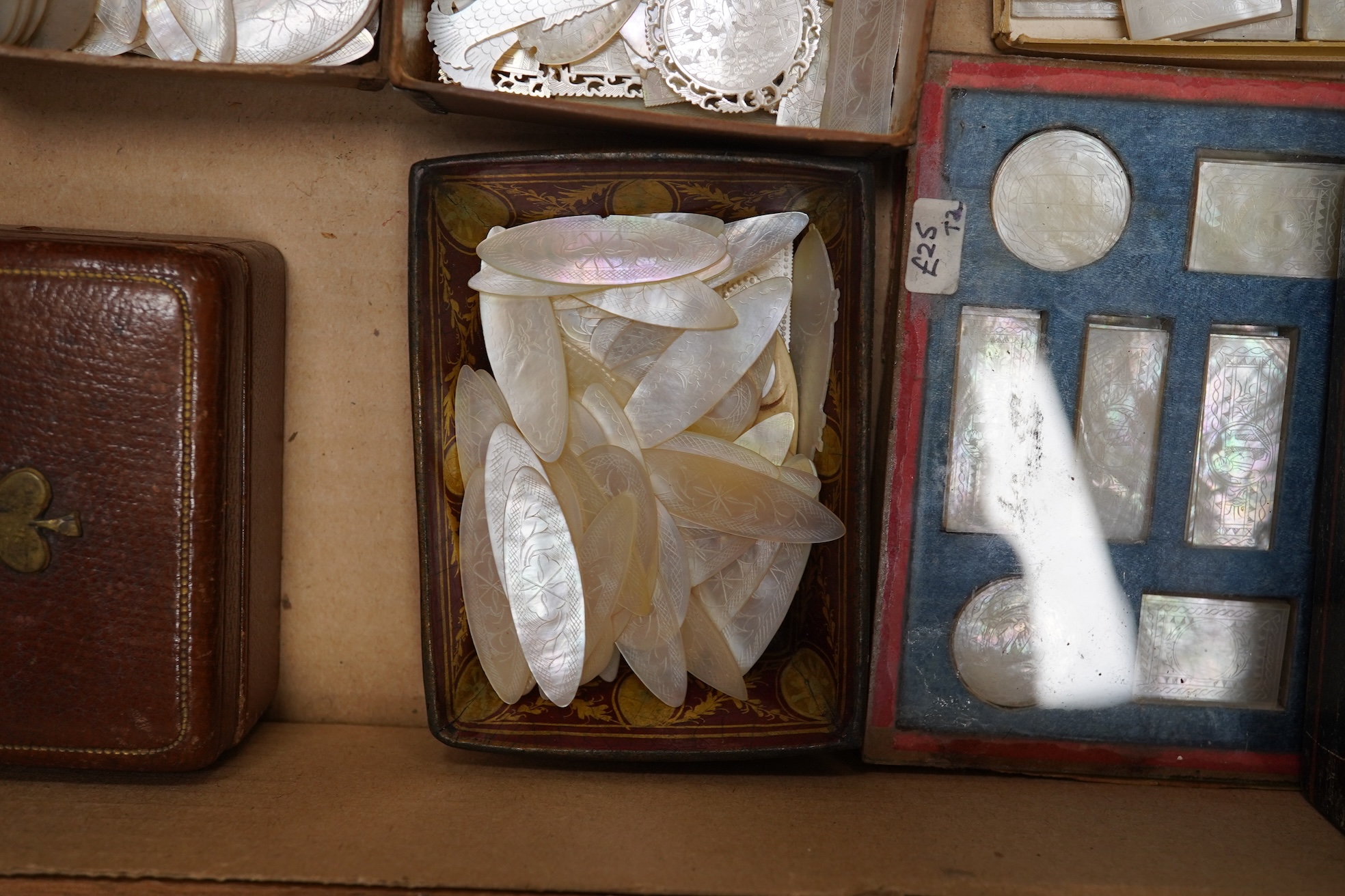 A group of 19th century Chinese mother of pearl gaming counters and accessories, together with a miniature silver cased compass